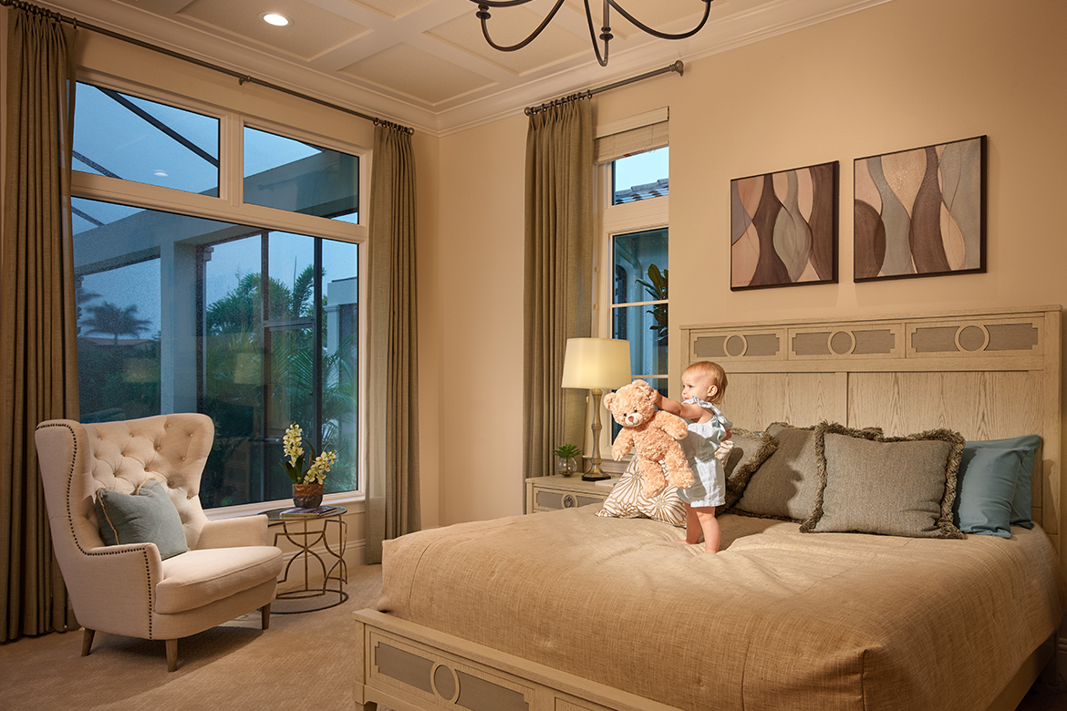 Child playing in bedroom with impact-resistant windows
