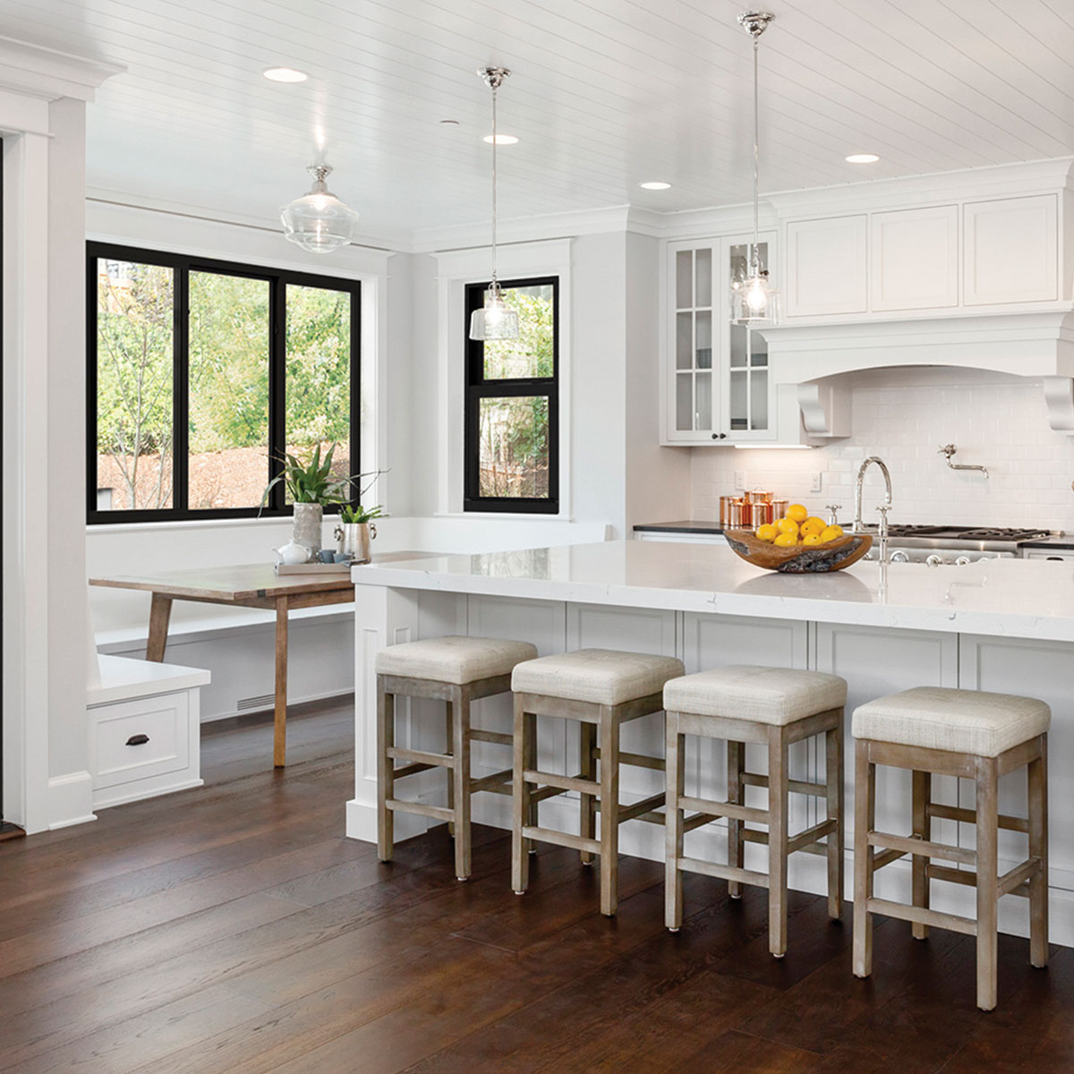 White kitchen with contrasting all-black window frames