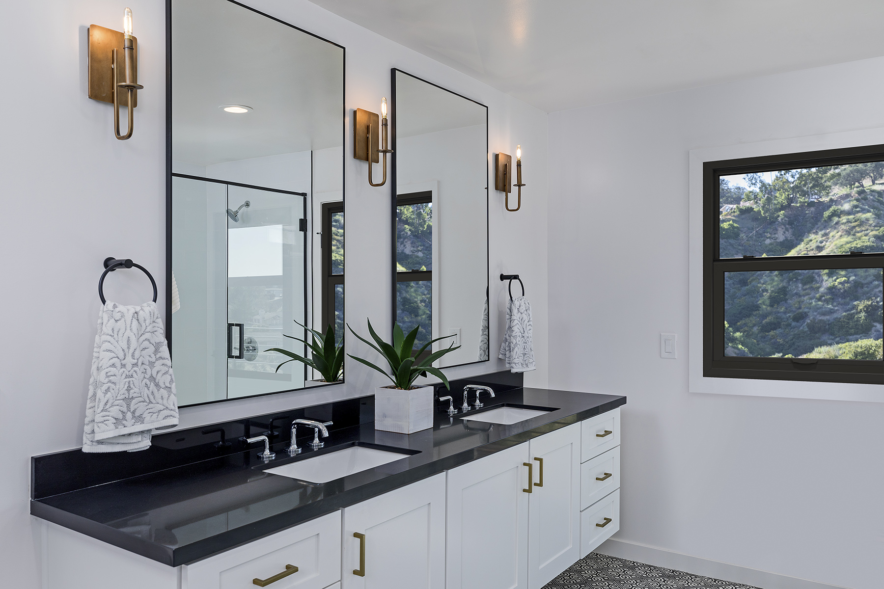 Bathroom with all-black window frame