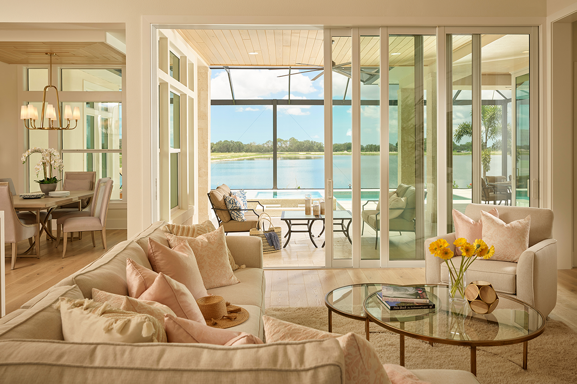 Coastal living room with hurricane impact windows and doors