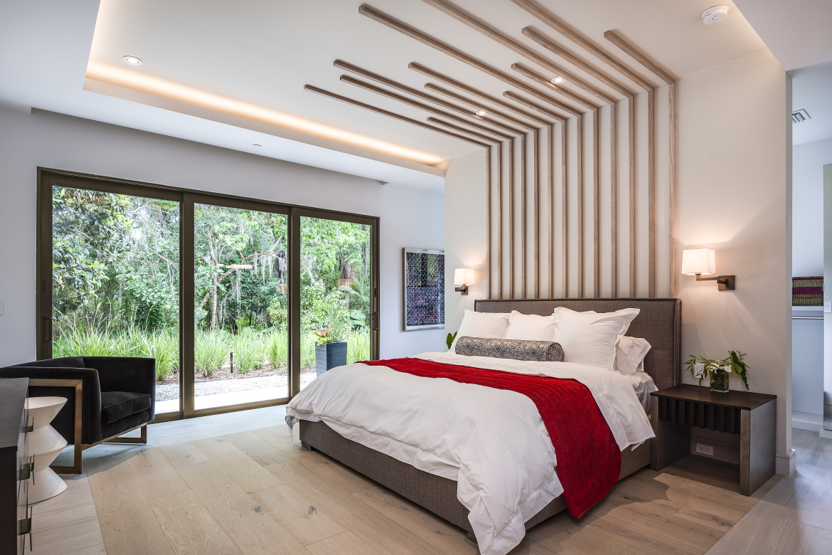 Quiet, comfortable bedroom with impact-resistant windows and doors